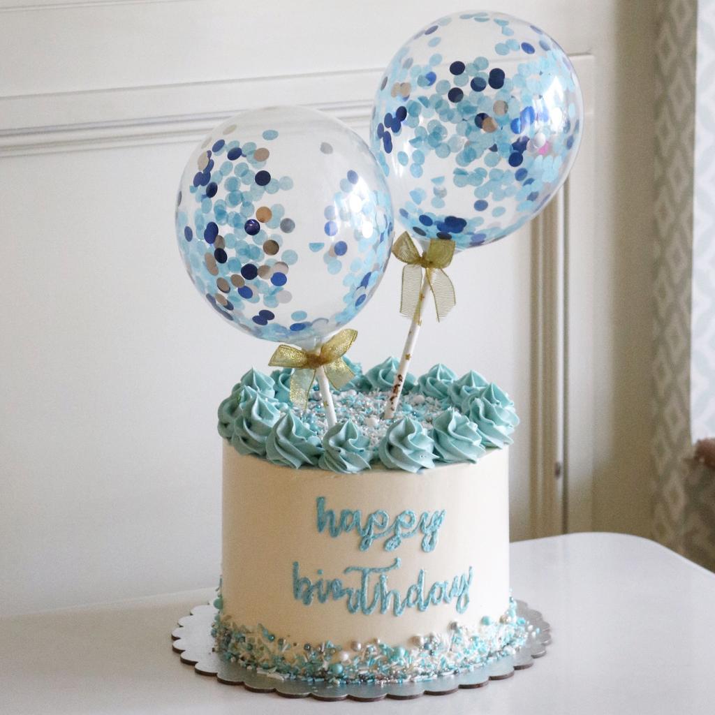 Confetti balloon birthday cake with blue frosting